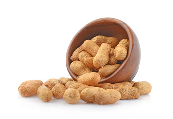 Peanut in wooden cups isolated on white background.