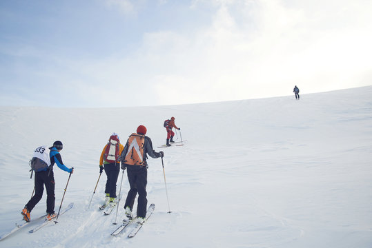 Skitouring Group With Mountain Views In Winter