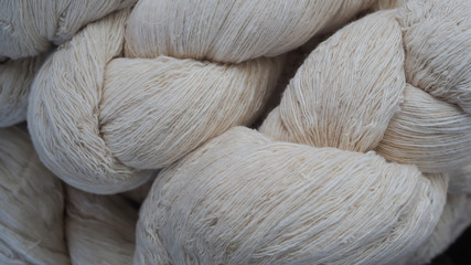 Balls of cotton yarn in a basket, color natural dyes handmade, soft focus and vintage tone for background