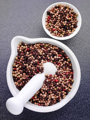 MIXED PEPPERCORNS IN PESTLE AND MORTAR