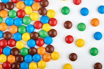 Abstract pattern with round color candy on background. Colorful sweets top view. Flat lay image