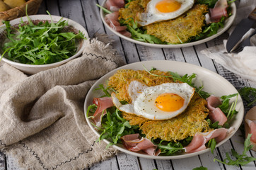 Potato pancakes with eggs and ham