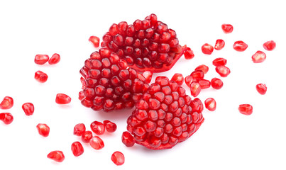 Ripe pomegranate seeds isolated on white