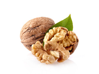 Walnuts with leaf in closeup on white background