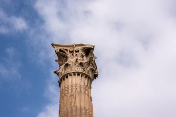 Close up of the top of a decorative, flowery Corinthian column, part of the ruins of the ancient, historic, beautiful Temple of Olympian Zeus.