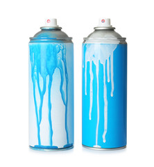 Used cans of spray paint on white background