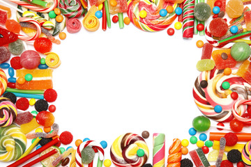 Many different yummy candies on white background, top view. Space for text
