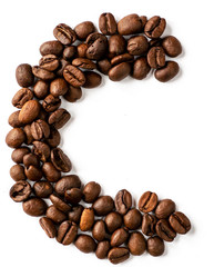 C letter made from coffee beans isolated on white background