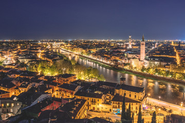 Fototapeta na wymiar Overlooking the city at Sunset and night time, Verona Italy