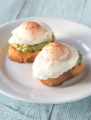 Sandwiches with guacamole and poached eggs