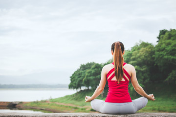 Asian woman doing yoga meditation