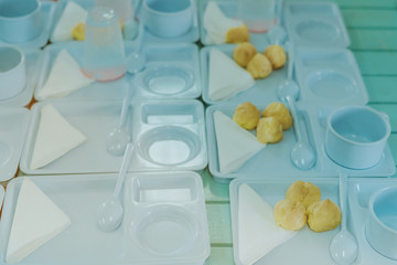 Students prepare snack and beverage for conference lunch break