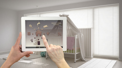 Smart remote home control system on a digital tablet. Device with app icons. Scandinavian nursery...