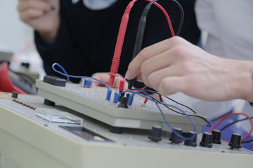 Two young students in technical vocational training, the lesson in technical college. Education and...