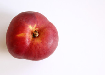 Nectarine on a white wooden background. Rich of nutritions, fiber, and vitamins. Picture design for foods background.