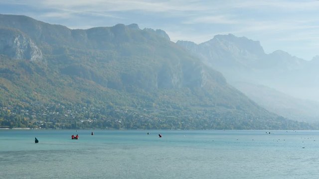 View on the famous lake of Annecy (in french "Lac d'Annecy"). Filmed in october. Cloudy sky.