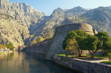 Fototapeta na wymiar Montenegro. Old Town of Kotor, UNESCO-World Heritage Site. View of Skurda river, walls of ancient fortifications and Kampana Tower