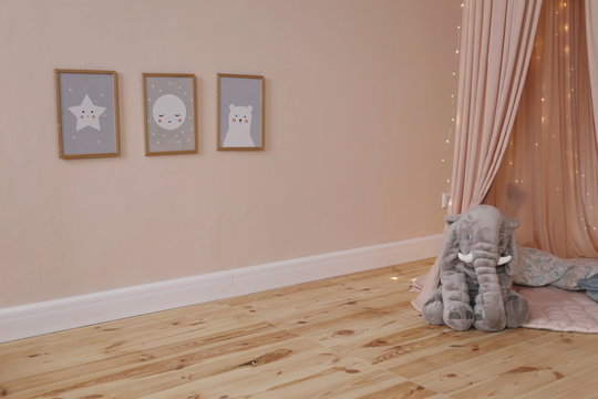 Pink Canopy And Gray Plush Elephant In The Children's Room Of Luxury Apartments