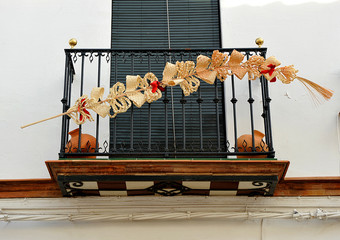 Balcony decorated for a religious procession, Holy Week (Semana Santa) in Seville, Andalusia, Spain 