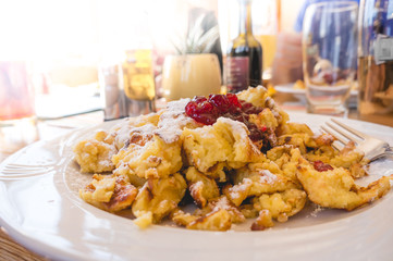 Kaiserschmarrn - traditional austrian pancake dessert served in a restaurant