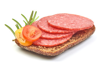Sandwich with Salami smoked sausage slices and tomatoes, isolated on a white background. Close-up
