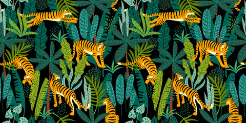 Seamless exotic pattern with tigers in the jungle. © Nadia Grapes