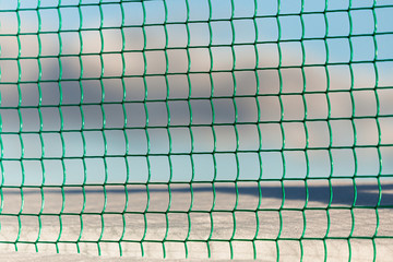blue-green durable steel metal mesh fence close-up