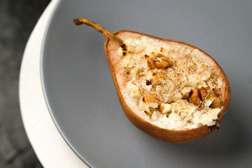 healthy vegan dessert, baked pears with nuts and honey.Selective focus
