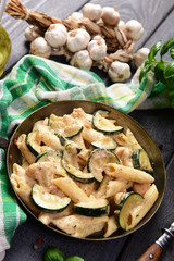 Fototapeta premium Penne pasta witch chicken and zucchini in cheese sauce