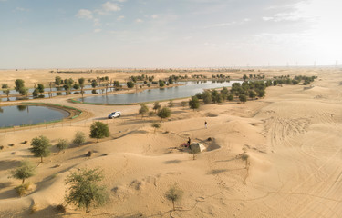couple in a desert near Al Qudra Lakes near Dubai