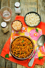 Split peas dal in a bowl on a wood background