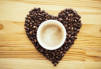 Good Morning. Coffee Time. Coffee to go and beans on a wooden background