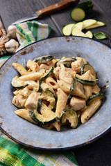 Penne pasta witch chicken and zucchini in cheese sauce