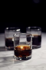 Old fashion glass of whiskey and cola on a dark background