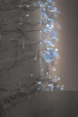Fairy light on the concrete gray wall