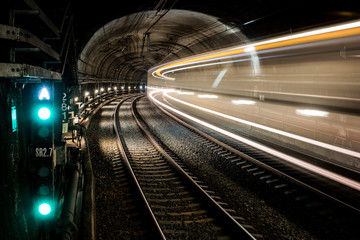 Train speeding through a subway tunnel