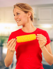 GIRL EATING SWEETCORN