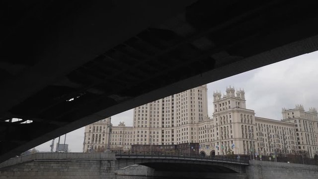 Stalin Vysotka on Kotelnicheskaya embankment view from Moscow river. Late autumn in the capital's quays. Navigable walking river.