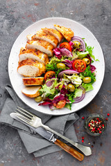 Grilled chicken meat, breast, fillet and fresh vegetable salad