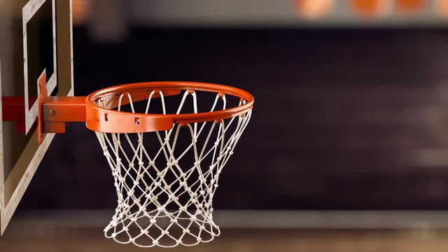 A beautiful throw basketball ball in a ring on the basketball arena