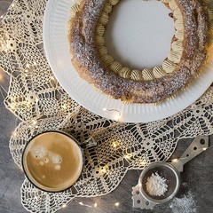 Paris Brest, classic French dessert consist of baked ring of choux pastry, filled with soft...