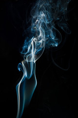 Obraz premium Blue smoke isolated on black background