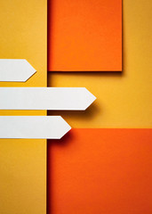 Three white arrows on a paper background