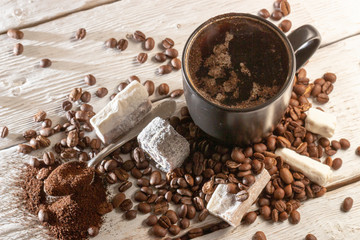 Cup of coffee and sweets Turkish delight on white table