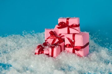 Christmas gifts, concept. Lots of gift boxes on blue background.