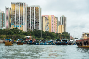 Fototapeta na wymiar Sampan cruise in Aberdeen harbour, famous for the floating village with old junks and house boats, Hong Kong