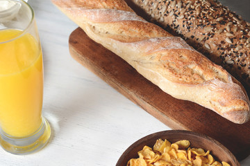 bowl of cereal, orange juice and toast