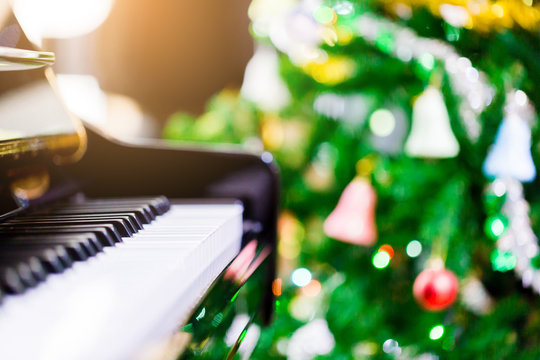 Piano And Shine To Christmas Tree For Christmas Holiday Background.