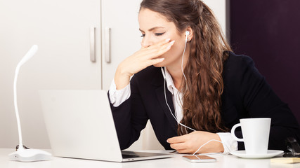 stressed out business woman with headset earphones angry concentrated in conference call