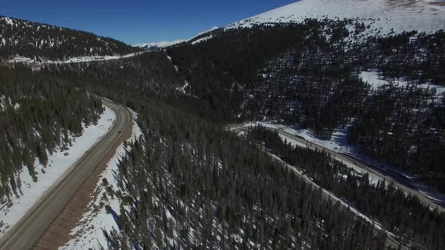 Aerial drone footage of Colorado highway over  Berthoud Pass and Continental Divide
